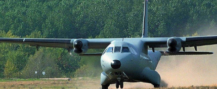 Military Transport Aircraft Taking Off from Runway Dust Cloud